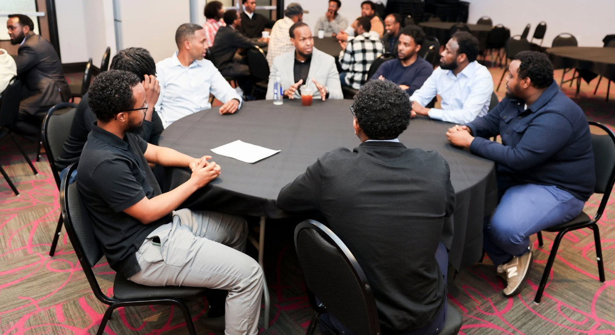 Attendees participating in a roundtable conversation